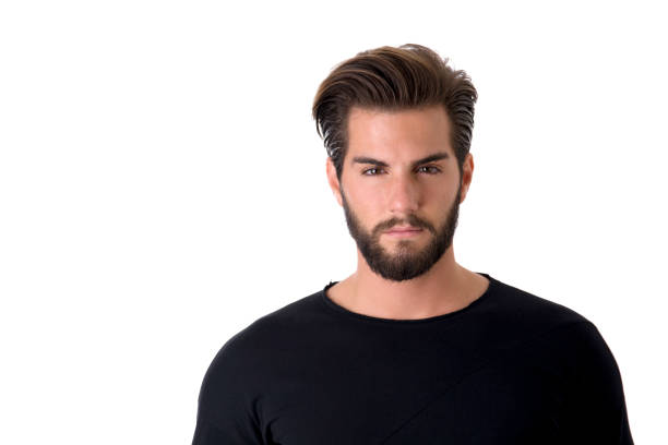 Head and shoulders shot of handsome young man with black shirt, looking at camera, on light background
