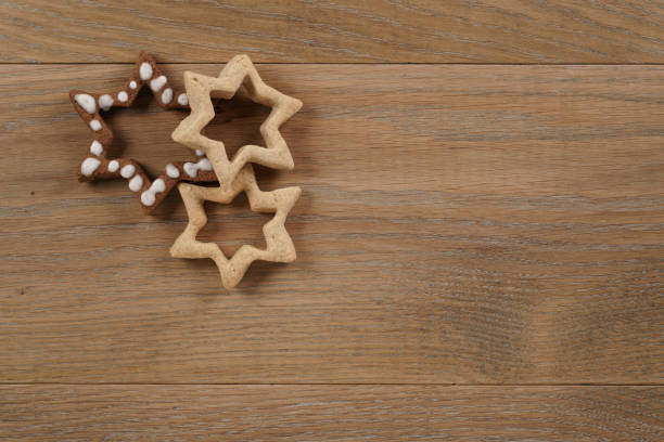 istock star shaped gingerbread and chocolate cookies on wooden background 1489714127