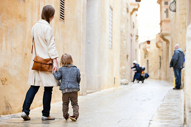 istock Mother and daughter in city 148972571