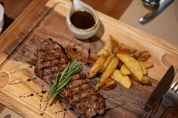 istock Medium rare meat on plate with sauce and fries 1489735460