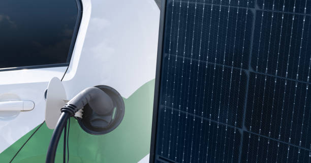 istock Close up of electric car with solar panel 1489735649