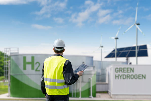 Engineer with tablet computer on a background of Hydrogen factory Engineer with tablet computer on a background of Green Hydrogen factory hydrogen power stock pictures, royalty-free photos & images