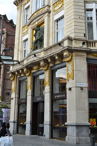 Antwerp, province Antwerp, Belgium - May 12, 2023: 2 African females walking in front of Rolex corner boutique