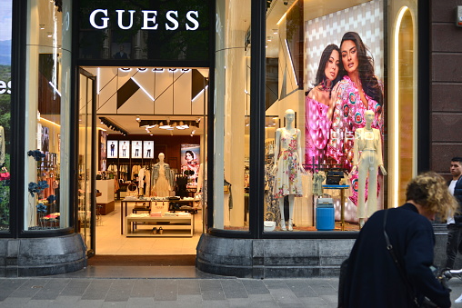 Antwerp, province Antwerp, Belgium - May 12, 2023: walking shoppers in front of Guess global brand