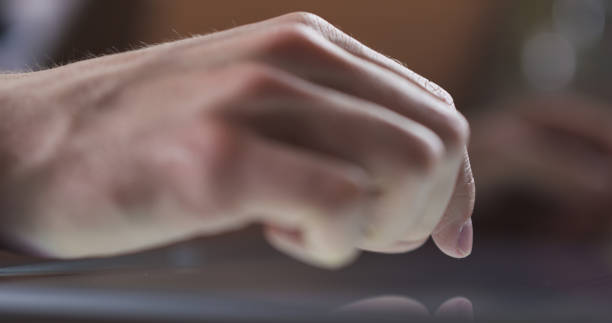 istock young man hand using tablet pc on table in cafe or home very shallow focus 1489735941