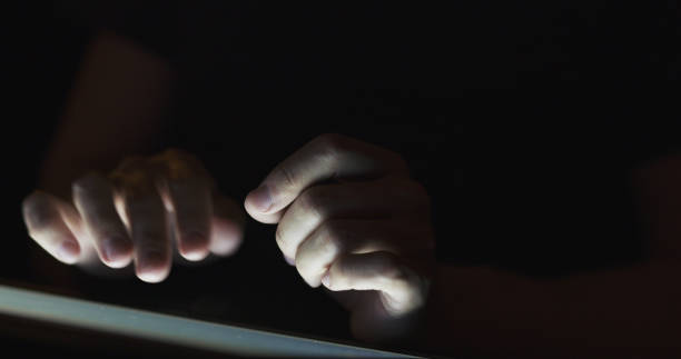 istock young man using tablet pc in the dark environment very shallow focus 1489736084