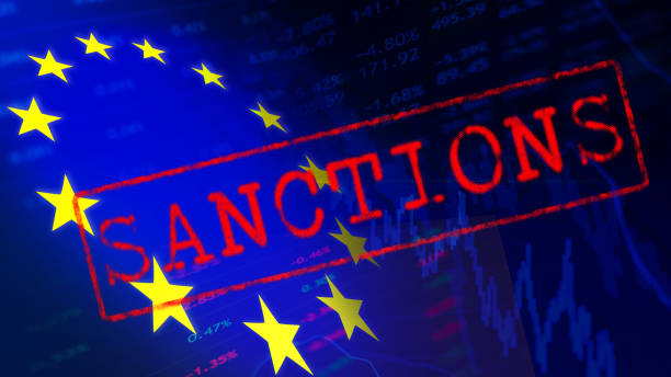 the inscription sanctions on the background of the flag of the european union and falling stock charts - currency exchange currency european union currency dollar imagens e fotografias de stock