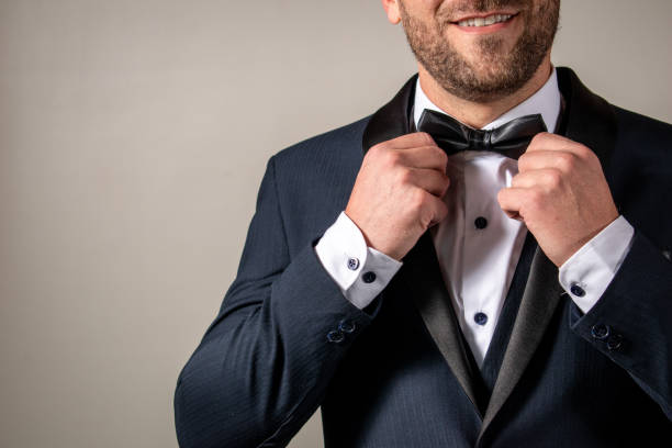 istock Business man in elegant suit. Elegant man smiling 1489747950