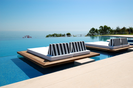 Infinity swimming pool by beach at the modern luxury hotel, Pieria, Greece