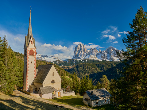 St.-Jakobs-Kirche/ Chiesa di San Giacomo.\nThe church of S. Giacomo is located above Ortisei, along the ancient Via Troi Paian, and can only be reached on foot, with a beautiful path that starts from S. Cristina (Plesdinaz). It is said that here he was baptised S. James, patron saint of walkers and pilgrims. According to sources, it is the oldest church in the valley. In fact, it dates back to the twelfth century, although the current external appearance is Gothic; the interior decoration is Gothic and Baroque.