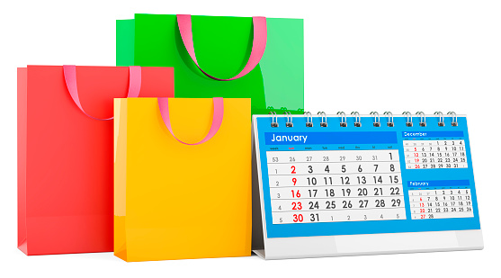 Shopping bags with desk calendar, 3D rendering isolated on white background