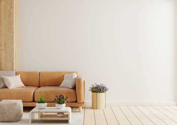 istock White wall interior living room have orange leather sofa and decoration minimal. 1489762107
