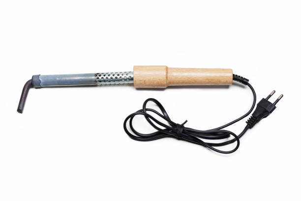 istock Soldering iron with wooden handle isolated on white 1489764188