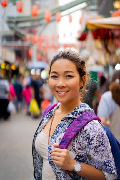 istock Young Asian woman with backpack solo travelling. 1489764695