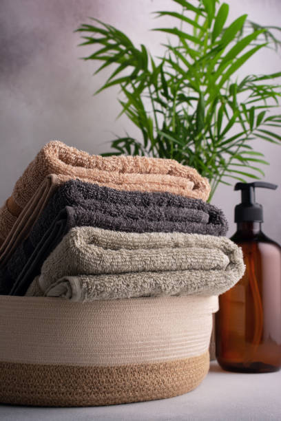 istock Folded fluffy cotton towels in basket 1489768957