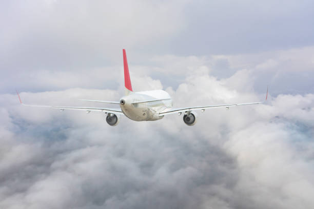 istock Commercial Jet airplane flying over clouds. 1489772858