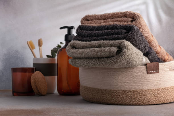 istock Folded fluffy cotton towels in basket 1489774268