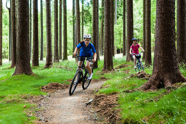 istock Two women riding bikes in forest 148977695