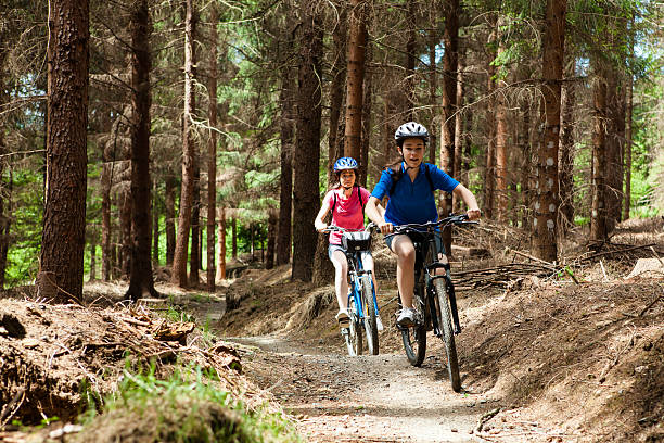 istock Two women riding bikes in forest 148977792