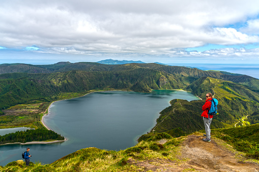 Women and men at the viewpoint of Lagoa do Fogo Crater Lake San Miguel Island Azores, high angle view.