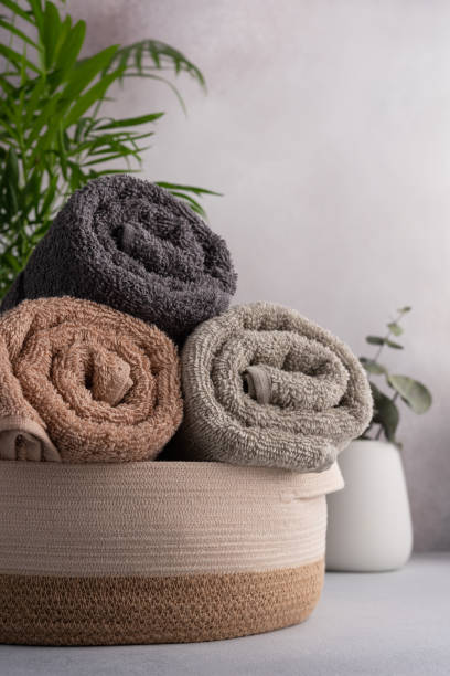 istock Rolled cotton towels in basket 1489786335