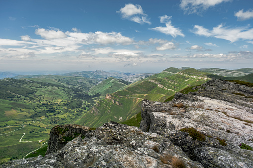 Karst landforms, steep slopes and green valley in the mountains