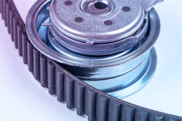 istock New timing belt with a tensioner roller on a white background macro 1489795429