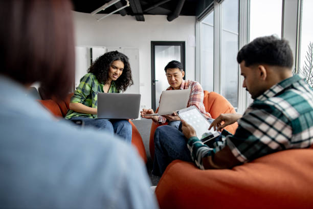 istock Teammates working on laptops and tablets in coworking space 1489795816