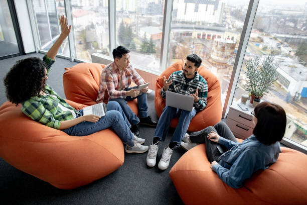 istock Colleagues with laptop asking question at conference indoors 1489796042
