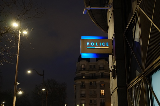 A close-up on the police sign by night. Paris, France - February 1, 2022.