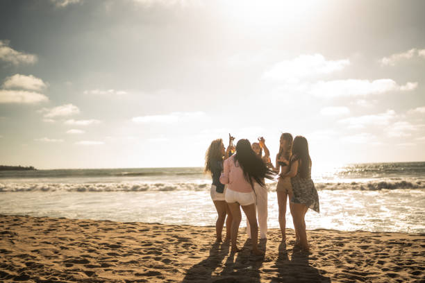 istock Female friends dancing during a celebration on the beach 1489807122