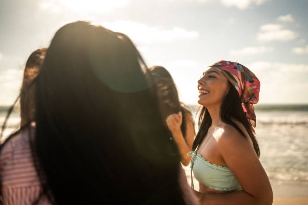 istock Female friends dancing during a celebration on the beach 1489807171