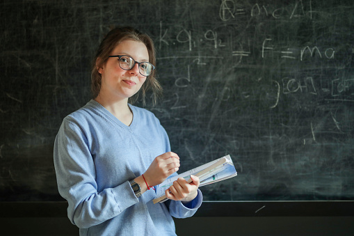 Education, Schoolgirl in Glasses with Textbook in Front of Blackboard, Back To School, Exam Preparations