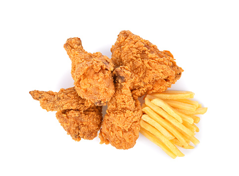 Fried chicken and french fries isolated on white background. Top view
