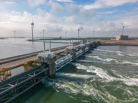 This aerial photo taken with a drone shows the Oosterscheldekering, also known as Eastern Scheldt Storm Surge Barrier.  This bridge over the water in Zeeland also protects the land behind the barricade against high tide and flooding.  It is part of the Delta Works.