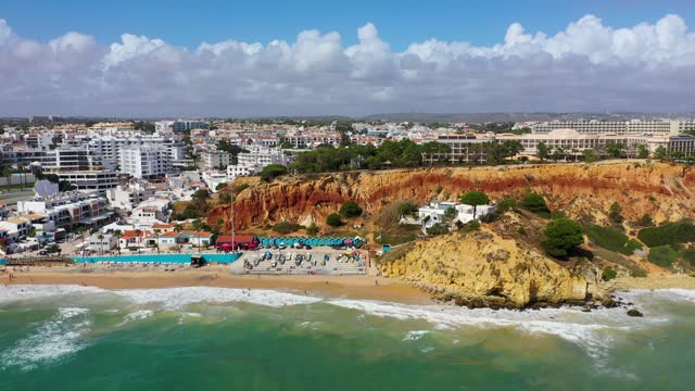 Amazing view from the sky of town Olhos de Agua in Albufeira, Algarve, Portugal. Aerial coastal view of town Olhos de Agua, Albufeira area, Algarve, Portugal.