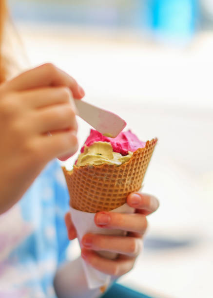 istock Female hand holding ice cream 1489809963