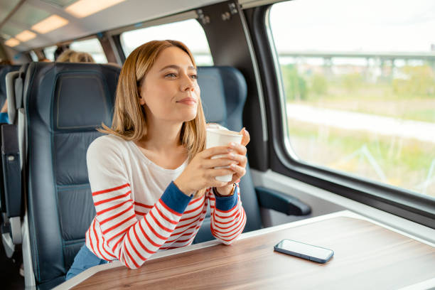 istock Female Commuter Enjoying Reusable Coffee Cup 1489810776
