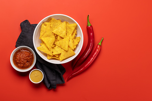 Mexican food featuring nachos. Flat lay with copy space