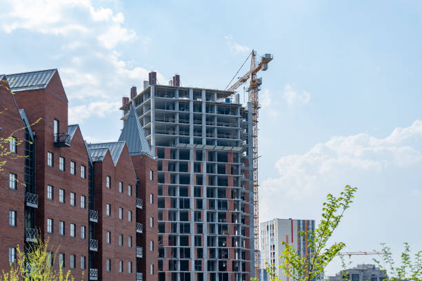 istock Industrial construction cranes work above new modern building. 1489813876