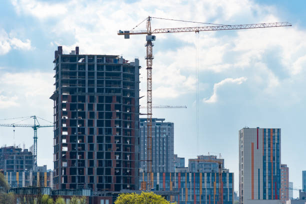 istock Industrial construction cranes work above new modern building. 1489813879