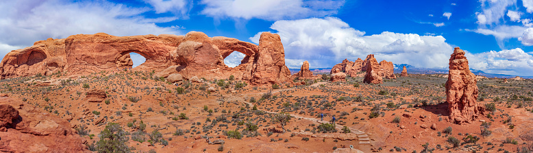 Delicate Arch at sunset on a stormy summer evening. Delicate Arch is one of the most popular features in Arches National Park in Utah, USA.