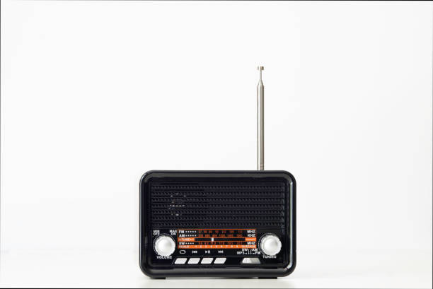 istock small antique radio with a white background 1489817240