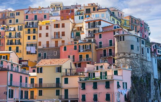 Manarola Village, stacked colorful villas in the province of La Spezia, Liguria, northern Italy, on the Cinque Terre coastline.