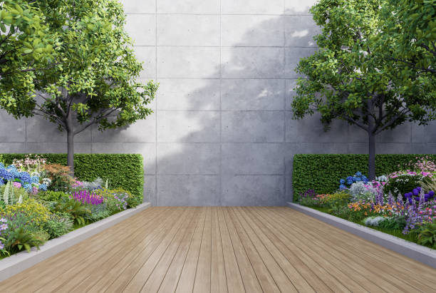 istock Empty exterior concrete wall with colorful flower garden 3d render 1489817598