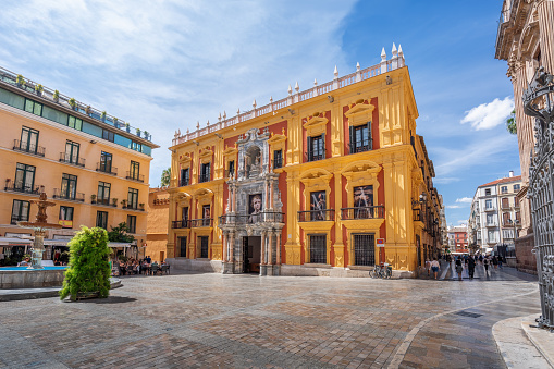 Malaga, Spain - May 19, 2019: Bishops Palace (Episcopal Palace) at Plaza del Obispo (Bishops Square) - Malaga, Andalusia, Spain
