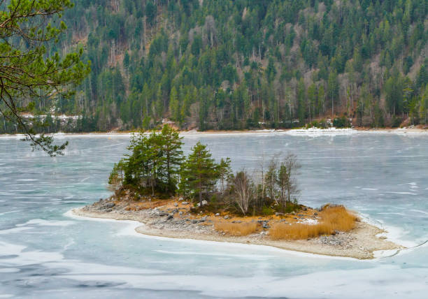 istock Lake Island in frozen Eibsee Germany 1489826346