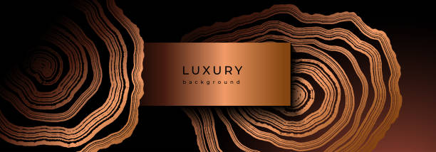 Luxury golden background with wood annual rings texture Luxury golden background with wood annual rings texture. Banner with shiny tree ring pattern. Stamp of tree trunk in section. Natural wooden concentric circles. Black and bronze gold background polished timber wood background stock illustrations
