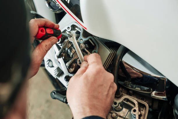 istock adjusting engine valves of motorcycle at the workshop 1489836055
