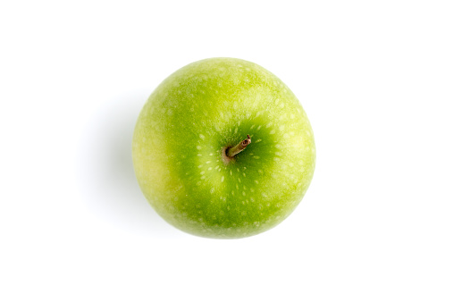 Red apples with green leaf and half slice on wooden table background. Top view. Flat lay.